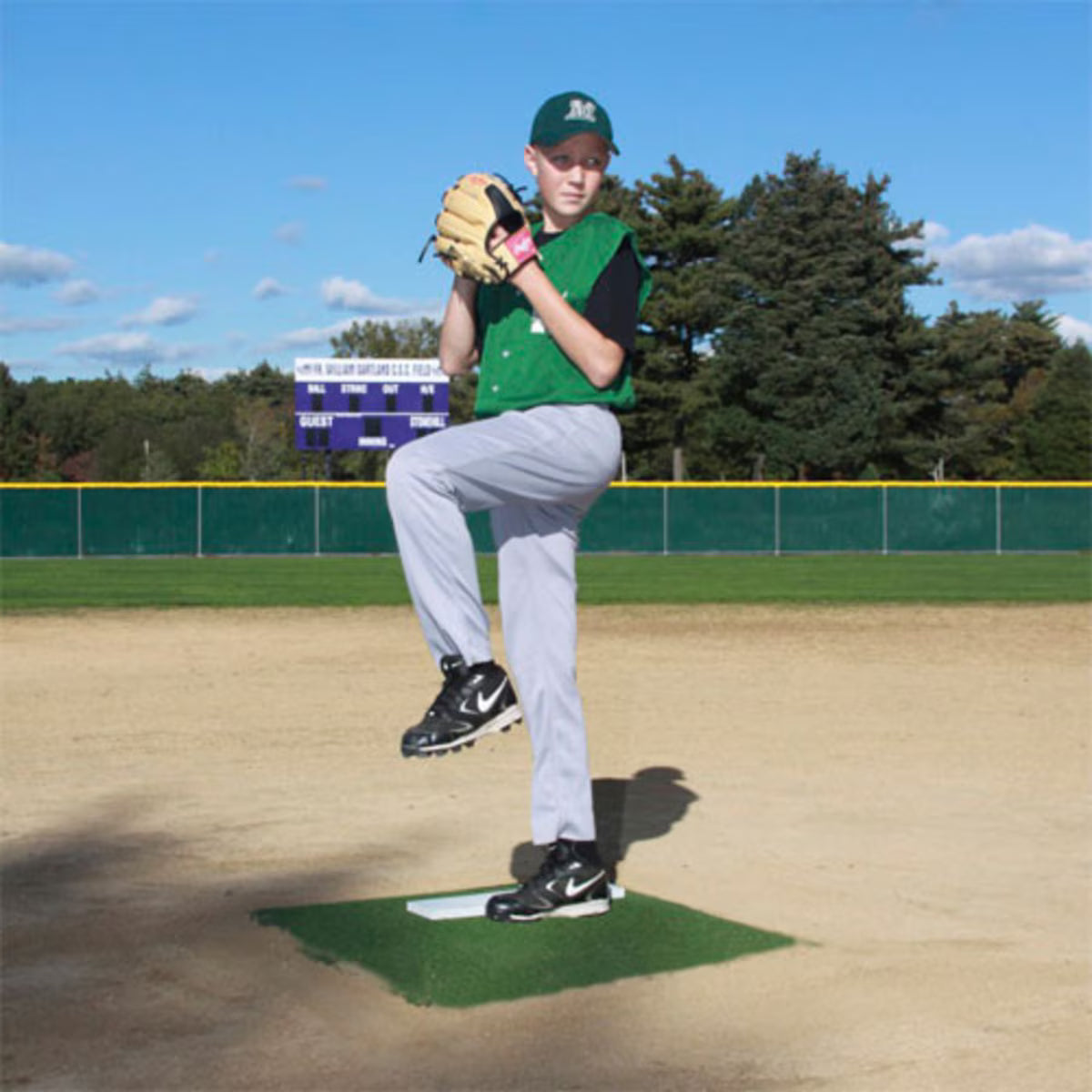ProMounds Pitcher's Training Mounds 4" with pitcher about to throw the ball on the green version.