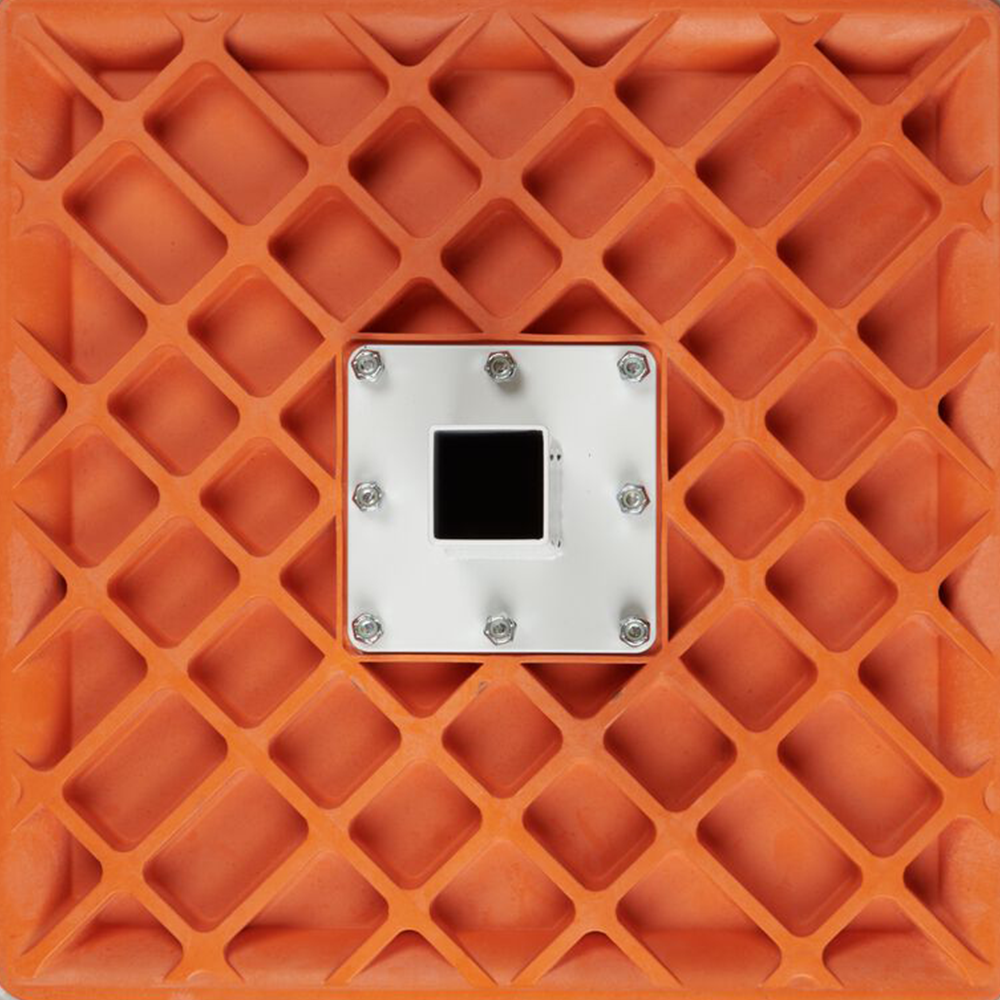 Bottom of a kwik release hollywood base orange with a white center for the anchor