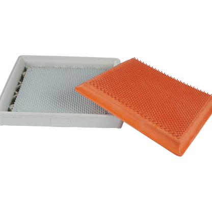 Bottom of the Hollywood base with the orange quick release insert slanted on top of the white base