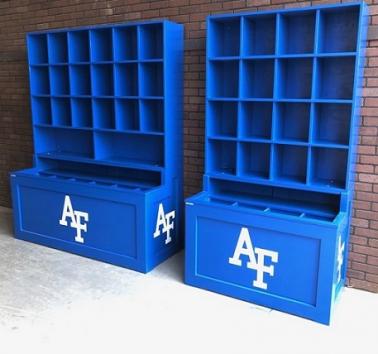 A blue helmet and bat rack combination unit with 'AF' logo on the lower base, designed for holding baseball helmets and equipment.
