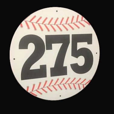 A round metal sign for baseball or sofball home run distances