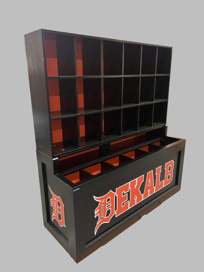 Black and orange storage unit with 'DEKALB' branding on a pallet in a warehouse.
