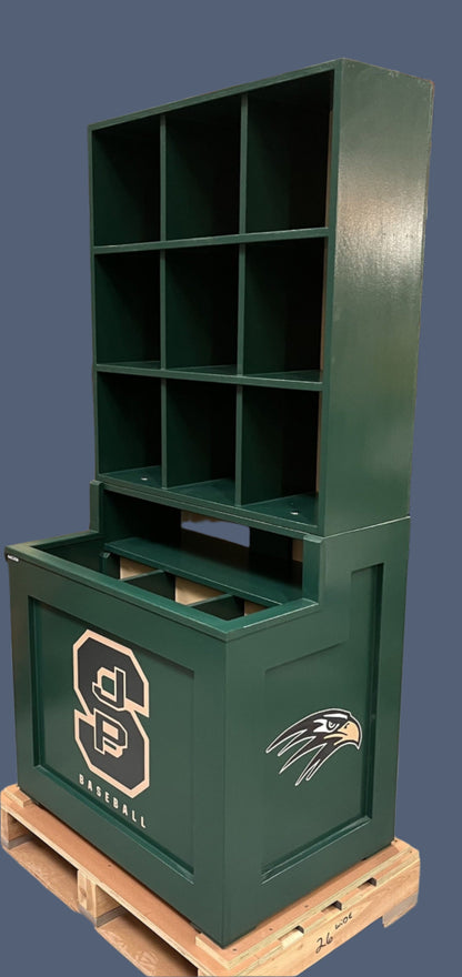 Green metal storage unit with logo on a wooden pallet in an indoor setting