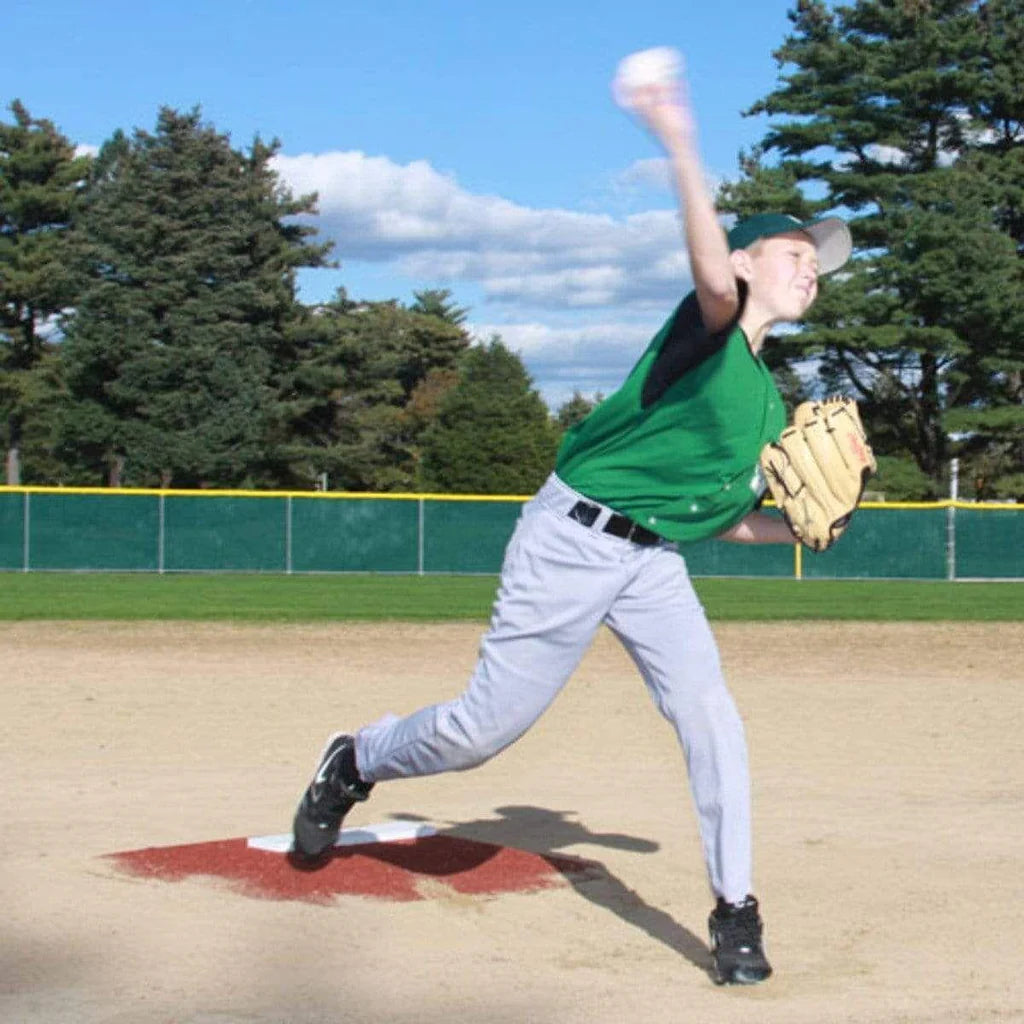 ProMounds Pitcher's Training Mounds 4" with pitcher mid throw and the ball is blurry on a clay color version. 