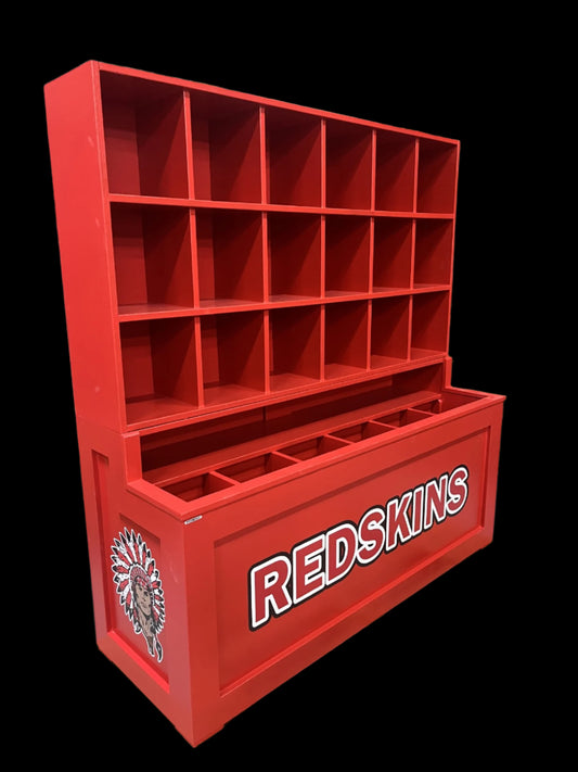 Red storage unit with 'REDSKINS' branding on a pallet in an industrial setting.