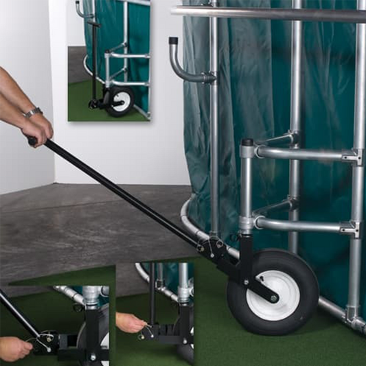 A person holding a dolly for a batting cage