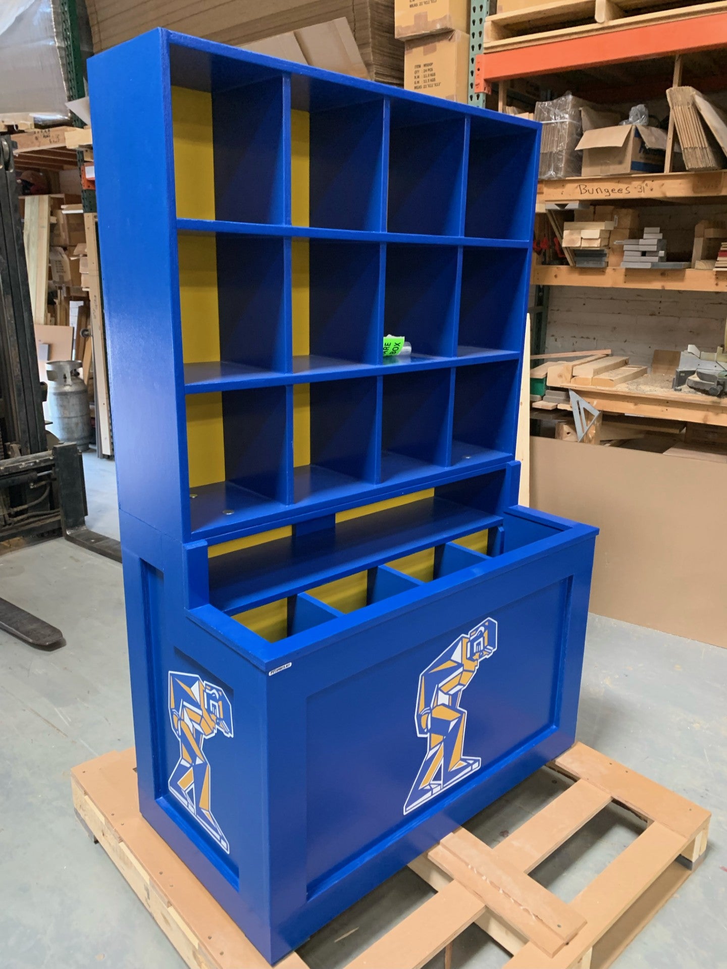 Blue storage unit with multiple compartments. Joliet Ironmen