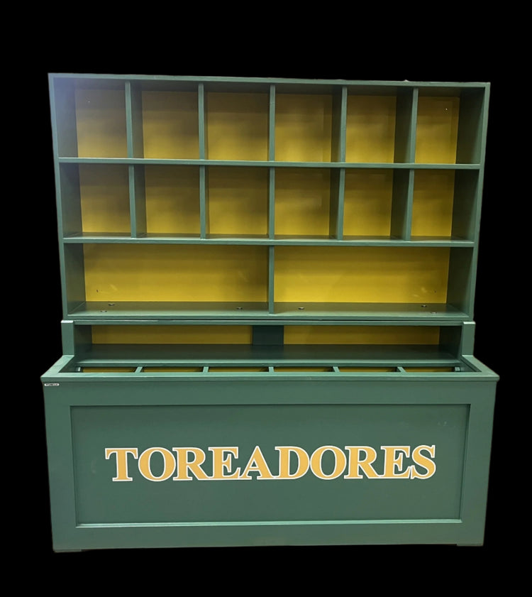 Green and yellow storage unit with 'TOREADORES' branding on a pallet in an indoor setting.
